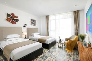 Łóżko lub łóżka w pokoju w obiekcie Kite Home Stay