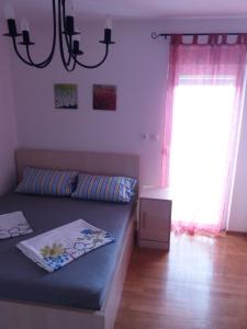 Ένα ή περισσότερα κρεβάτια σε δωμάτιο στο Holiday home with sea view