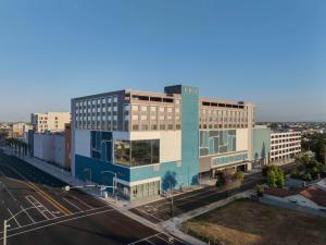 an aerial view of a building on a city street at Hilton Buena Park Anaheim in Buena Park