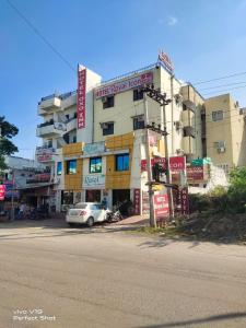 a building with a car parked in front of it at Hotel Royal Icon in Udaipur