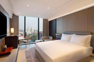 Rúm í herbergi á Hilton Kathmandu
