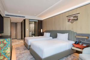 Rúm í herbergi á Hilton Kathmandu