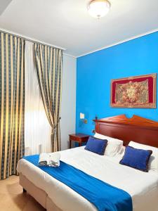 Postel nebo postele na pokoji v ubytování D'Angelo Palace Hotel