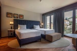 Keight Hotel Opatija, Curio Collection By Hilton客房内的一张或多张床位