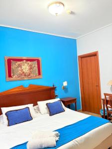Postel nebo postele na pokoji v ubytování D'Angelo Palace Hotel