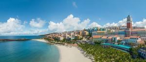 a view of a beach with buildings and the ocean at La Festa Phu Quoc, Curio Collection By Hilton in Phu Quoc