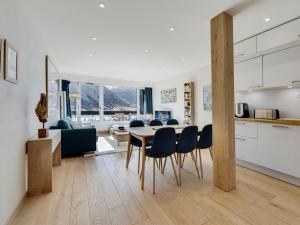 a kitchen and dining room with a table and chairs at Appartement rénové et lumineux à Tignes le Lac, proche des pistes et commodités - FR-1-641-10 in Tignes