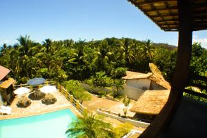 an aerial view of a resort with a swimming pool at Solange apartment-Casa em Ilheus-Olivença in Olivença +17 photos