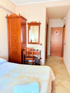 Postel nebo postele na pokoji v ubytování D'Angelo Palace Hotel