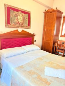 Postel nebo postele na pokoji v ubytování D'Angelo Palace Hotel