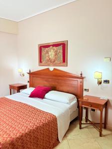 Postel nebo postele na pokoji v ubytování D'Angelo Palace Hotel