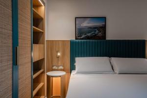 Terradamari Resort & Spa Marina di Modica,Tapestry by Hilton客房内的一张或多张床位