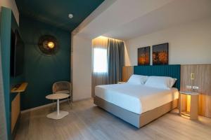 Terradamari Resort & Spa Marina di Modica,Tapestry by Hilton客房内的一张或多张床位