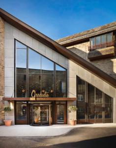 a store front of a building with glass windows at Graduate by Hilton Cambridge in Cambridge
