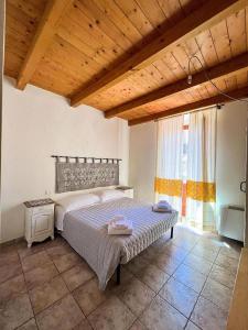 Postel nebo postele na pokoji v ubytování La Vecchia Torre