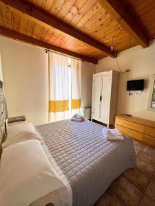 Postel nebo postele na pokoji v ubytování La Vecchia Torre + 17 fotografií