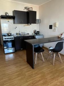 Η κουζίνα ή μικρή κουζίνα στο Departamento Peatonal II
