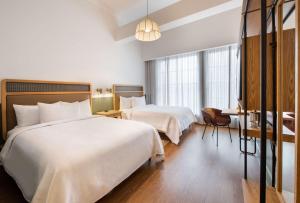 Hotel Theo New Orleans, Tapestry Collection by Hilton客房内的一张或多张床位