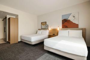 Postel nebo postele na pokoji v ubytování Spark By Hilton Las Vegas Airport