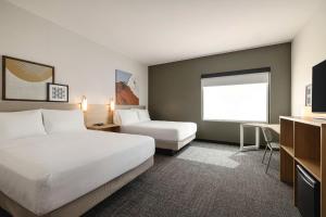 Postel nebo postele na pokoji v ubytování Spark By Hilton Las Vegas Airport