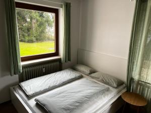 Ένα ή περισσότερα κρεβάτια σε δωμάτιο στο Apartment in Prien am Chiemsee