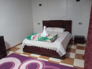 Postel nebo postele na pokoji v ubytování Al Sharif Hotel Apartments