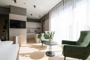 TV a/nebo společenská místnost v ubytování Taunus Suites
