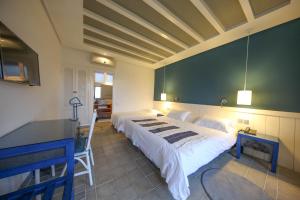 Hôtel l'Hippocampe客房内的一张或多张床位