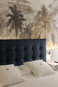 Postel nebo postele na pokoji v ubytování AH Art Hotel Palma