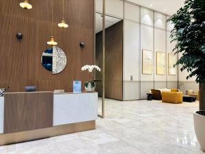 a lobby of a hotel with a reception desk at Luxury 1BR Apt Best view Infinity Pool Burj Khalifa with Balcony in Dubai +62 photos