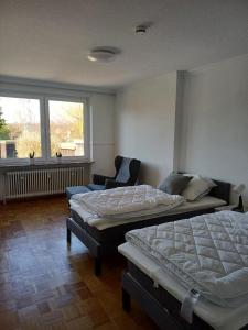 Postel nebo postele na pokoji v ubytování Gästezimmer Ilmenaudeich