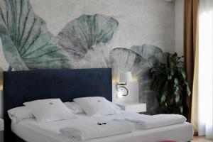 Postel nebo postele na pokoji v ubytování AH Art Hotel Palma