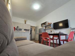 a living room with a couch and a table with chairs at Ca' Elide in Aosta