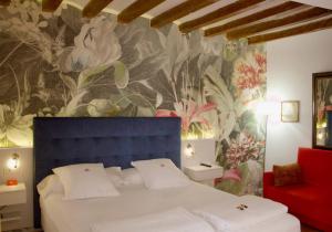 Postel nebo postele na pokoji v ubytování AH Art Hotel Palma