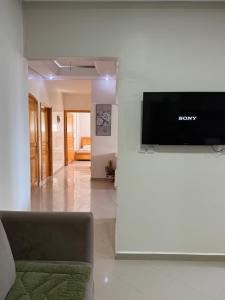 a living room with a sony television on a wall at Safiote House appartement in Safi