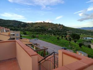 a view from the balcony of a house with a mountain at Luxury Penthouse 2 camere in Castiglione della Pescaia +7 photos