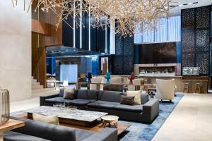 a lobby with couches and a bar at Hilton Mexico City Santa Fe in Mexico City