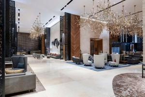 a lobby of a hotel with couches and chairs at Hilton Mexico City Santa Fe in Mexico City