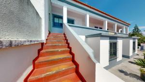 a stairway leading up to a building at Azores Pedra Apartments - G in Ponta Delgada