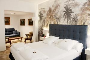 Postel nebo postele na pokoji v ubytování AH Art Hotel Palma