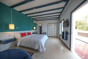 Hôtel l'Hippocampe客房内的一张或多张床位