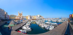 a marina filled with lots of boats in a harbor at Résidence BELLA VISTA in Santa-Maria-di-Lota