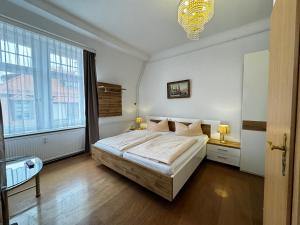 Postel nebo postele na pokoji v ubytování Hotel Zu den Linden