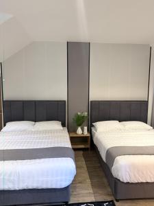 Winn's Hotel Bentong客房内的一张或多张床位