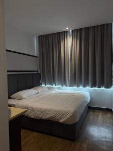 Winn's Hotel Bentong客房内的一张或多张床位