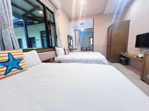 A bed or beds in a room at Fish's Home