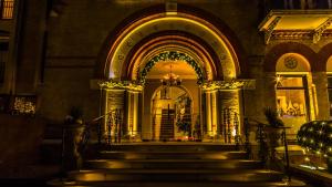 an entrance to a building with stairs at night at The Petersham in Richmond upon Thames