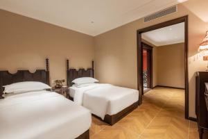 Voodi või voodid majutusasutuse Beijing Xiaofengxian Former Residence Hotel Tiananmen Square Qianmen Store toas