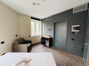 Postel nebo postele na pokoji v ubytování WEGA Hotel Verona