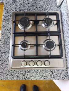 a stove top with four burners on a counter at Apart hotel Costa Verde#7 con cama Queen in Las Galeras +19 photos